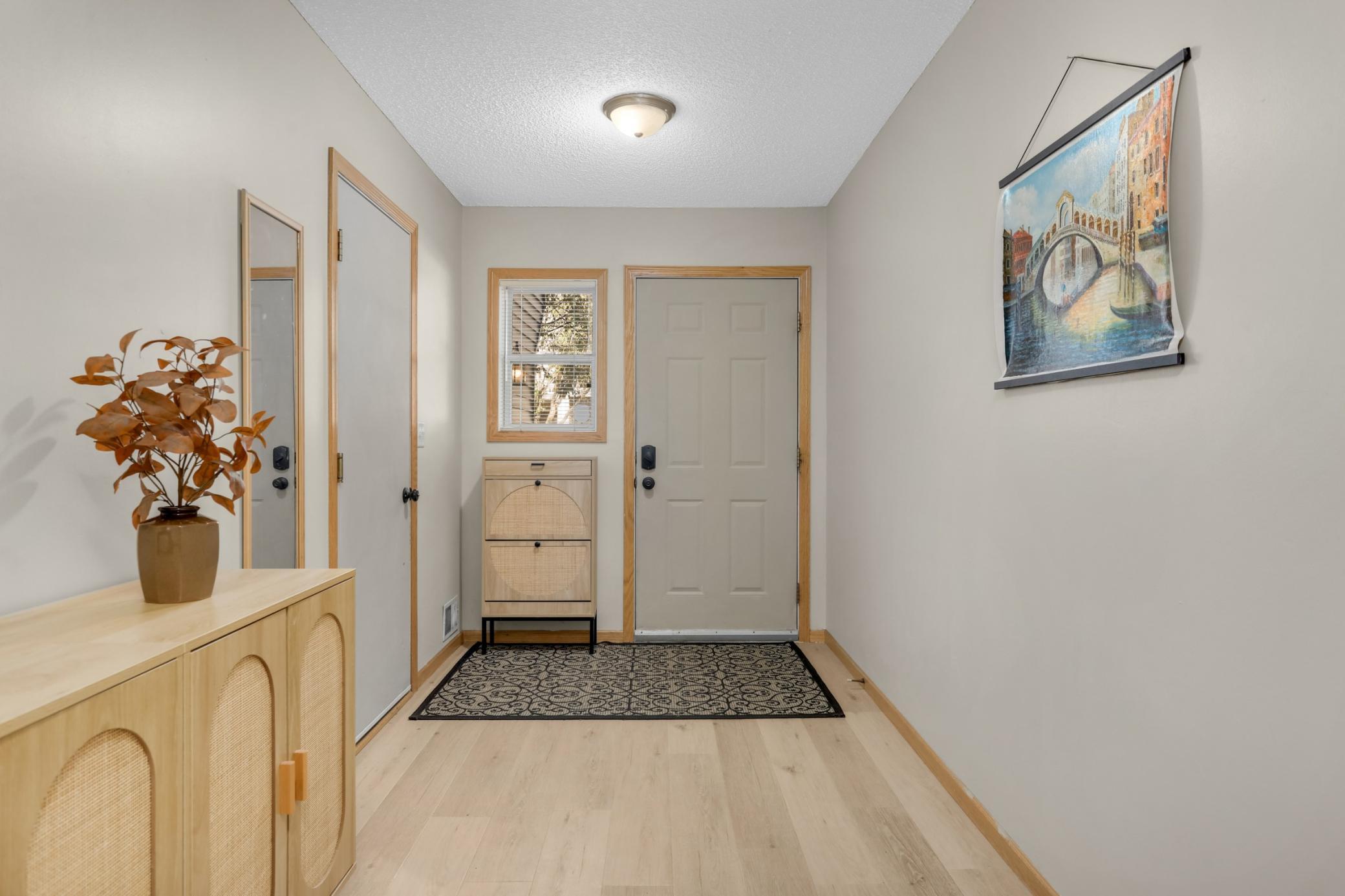 Bright entry foyer with new flooring