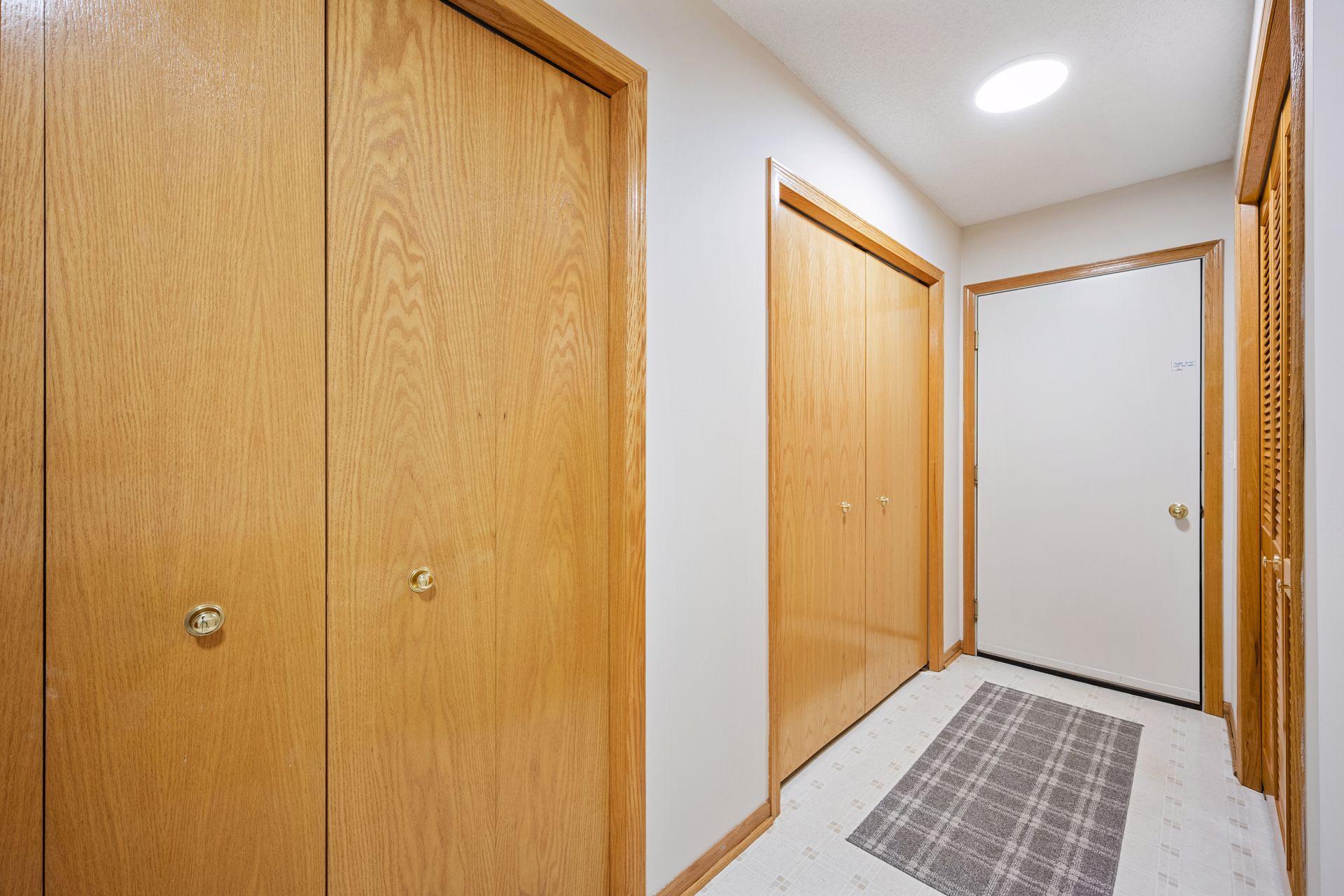 The entry from the garage has a wall of closets!