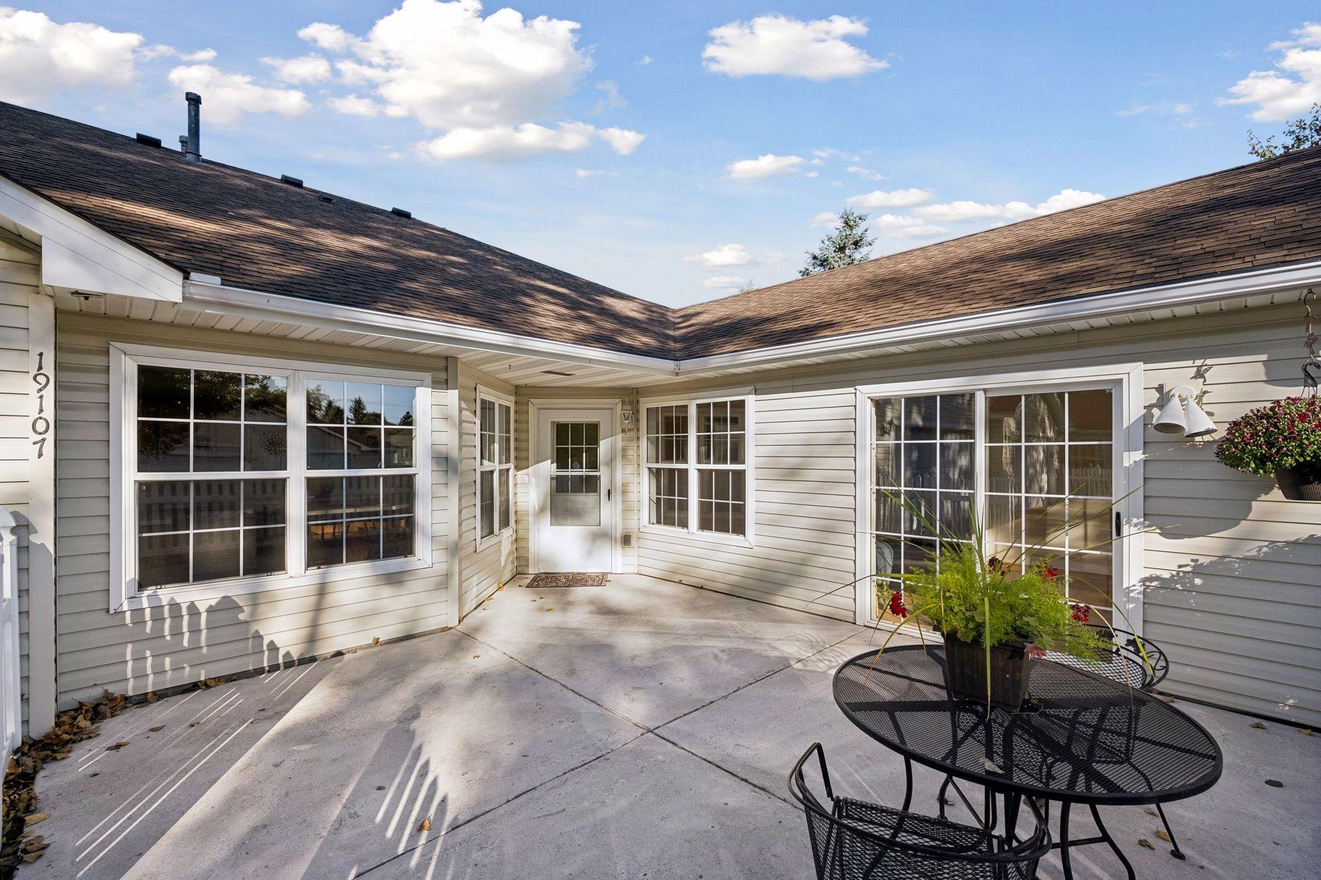 You can also access the patio through the sunrooms sliding glass door.