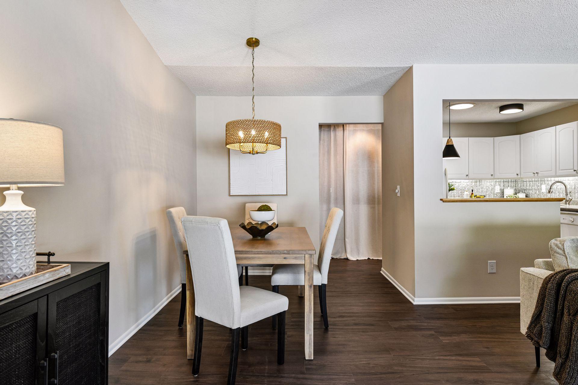 Dining open to living room and back hallway
