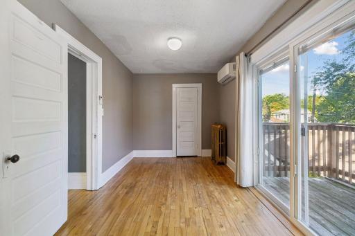 A ductless mini-split adds comfort, while the storage closet provides additional space in this second upper level bedroom.