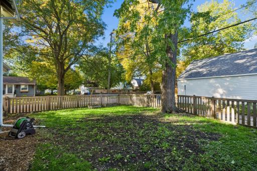 A fenced-in front and side yard gives you plenty of space to relax, entertain, and enjoy some time outside.