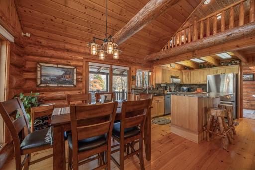 Large dining room that opens up into the kitchen