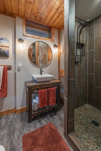 Lower level rustic bathroom with custom shower