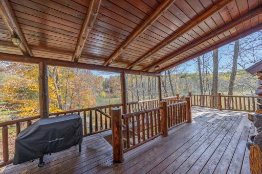 Enjoy the rear covered porch with views of the water
