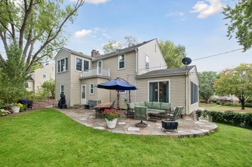 Spawling, spacious yard with custom paver patio.