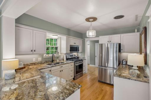 Thoughtfully designed newer kitchen with a breakfast bar and ample workspace.