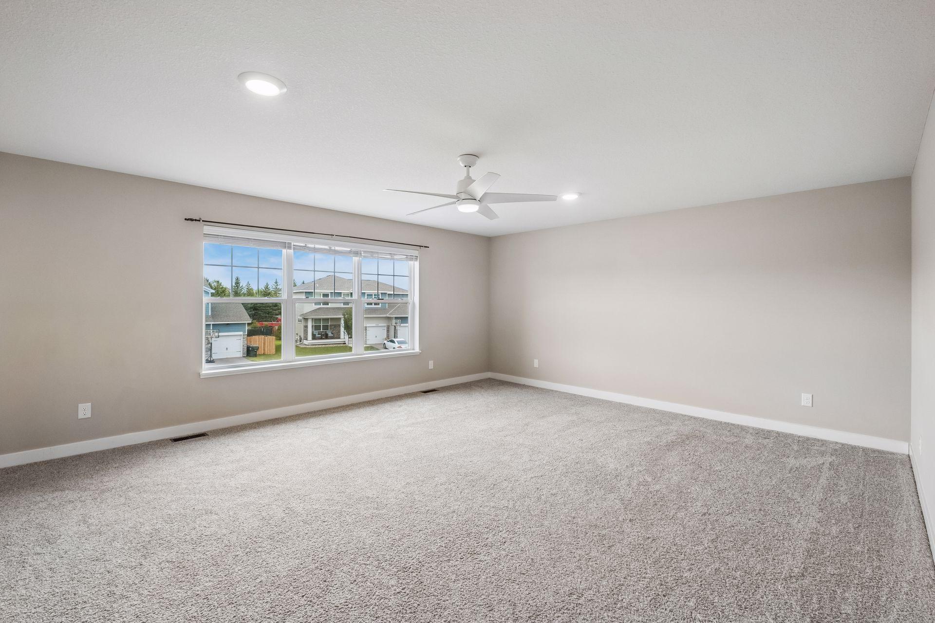 The Primary Suite is one of four bedrooms on the upper level