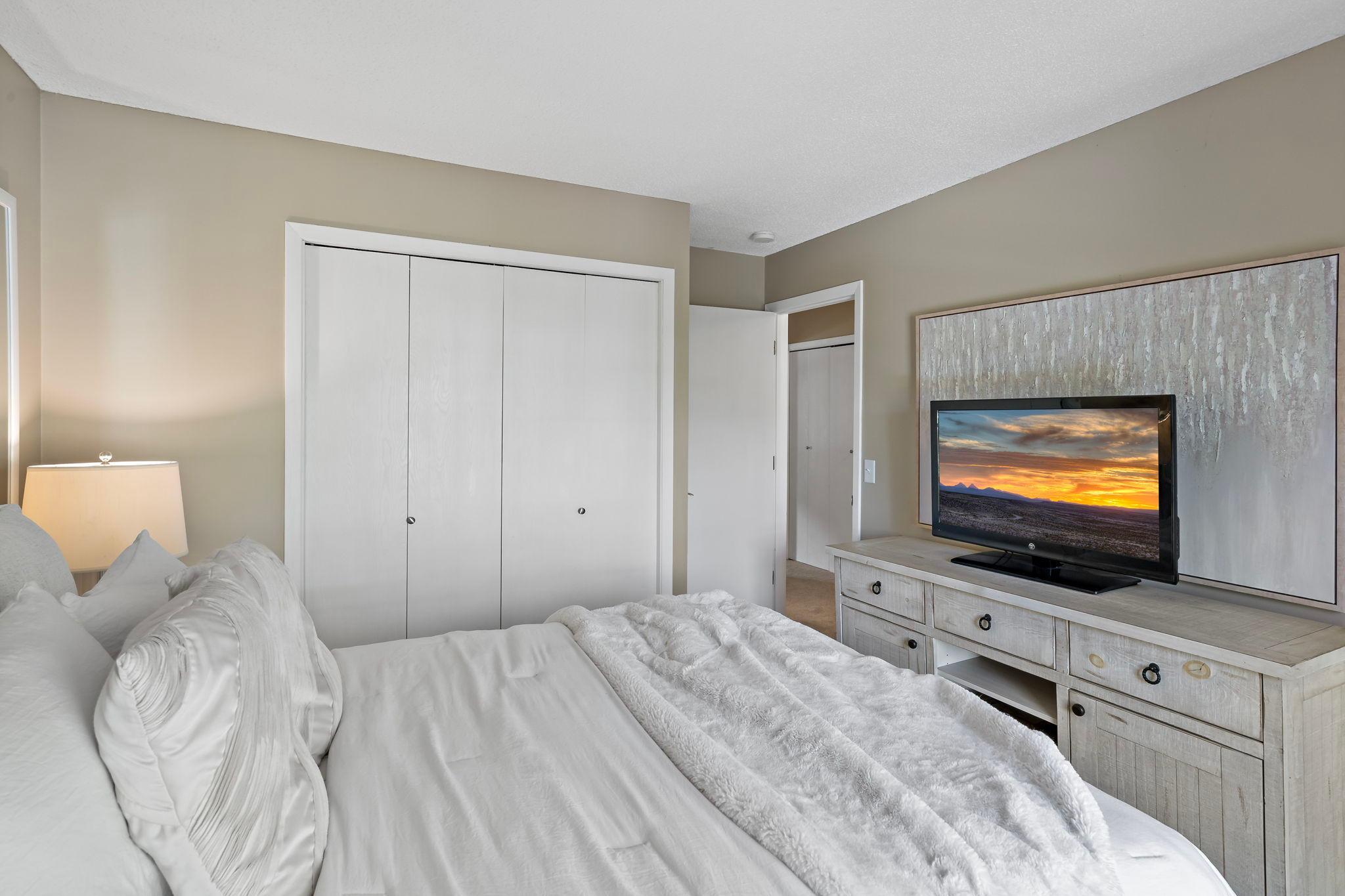 Bedroom two offers a functional closet along with direct access to an additional office or flex space, providing extra versatility for working from home, hobbies or additional storage.