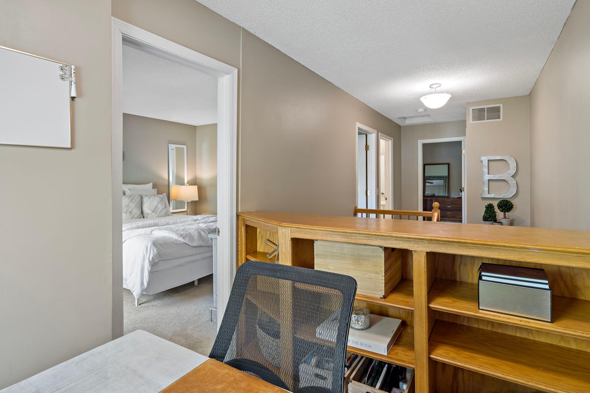 Tucked just off bedroom two, this flexible bonus space showcases built-in shelving & storage while highlighting the convenient connection to bedroom two. This versatile space could easily function as an office, reading nook, hobby area or storage.