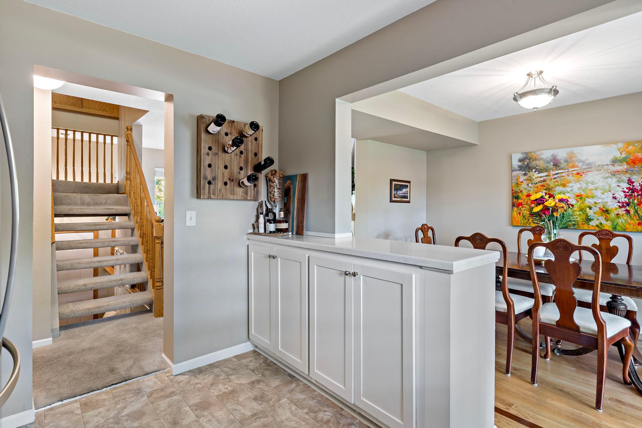 A convenient peninsula adds extra cabinetry, counter space and storage while creating an open connection between the kitchen and adjacent dining area—great for everyday living and entertaining.