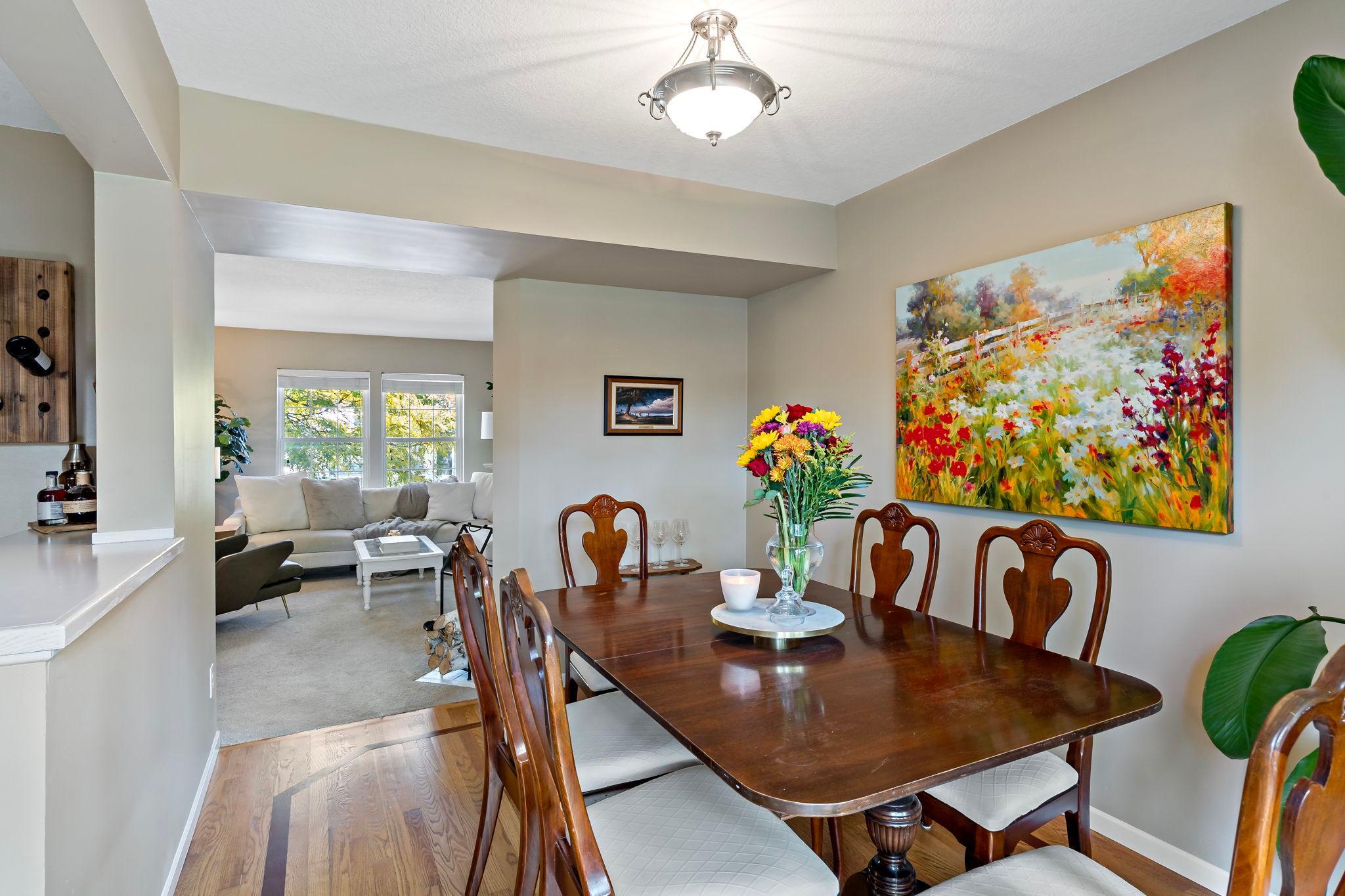 The dining room’s generous size and open connection to both the kitchen and living room, creating an easy flow throughout the main living spaces.