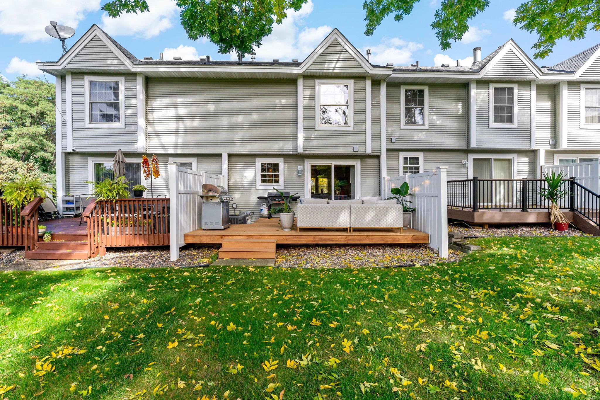 A rear view showcases the home’s new deck and plenty of space to relax, grill or entertain outdoors.