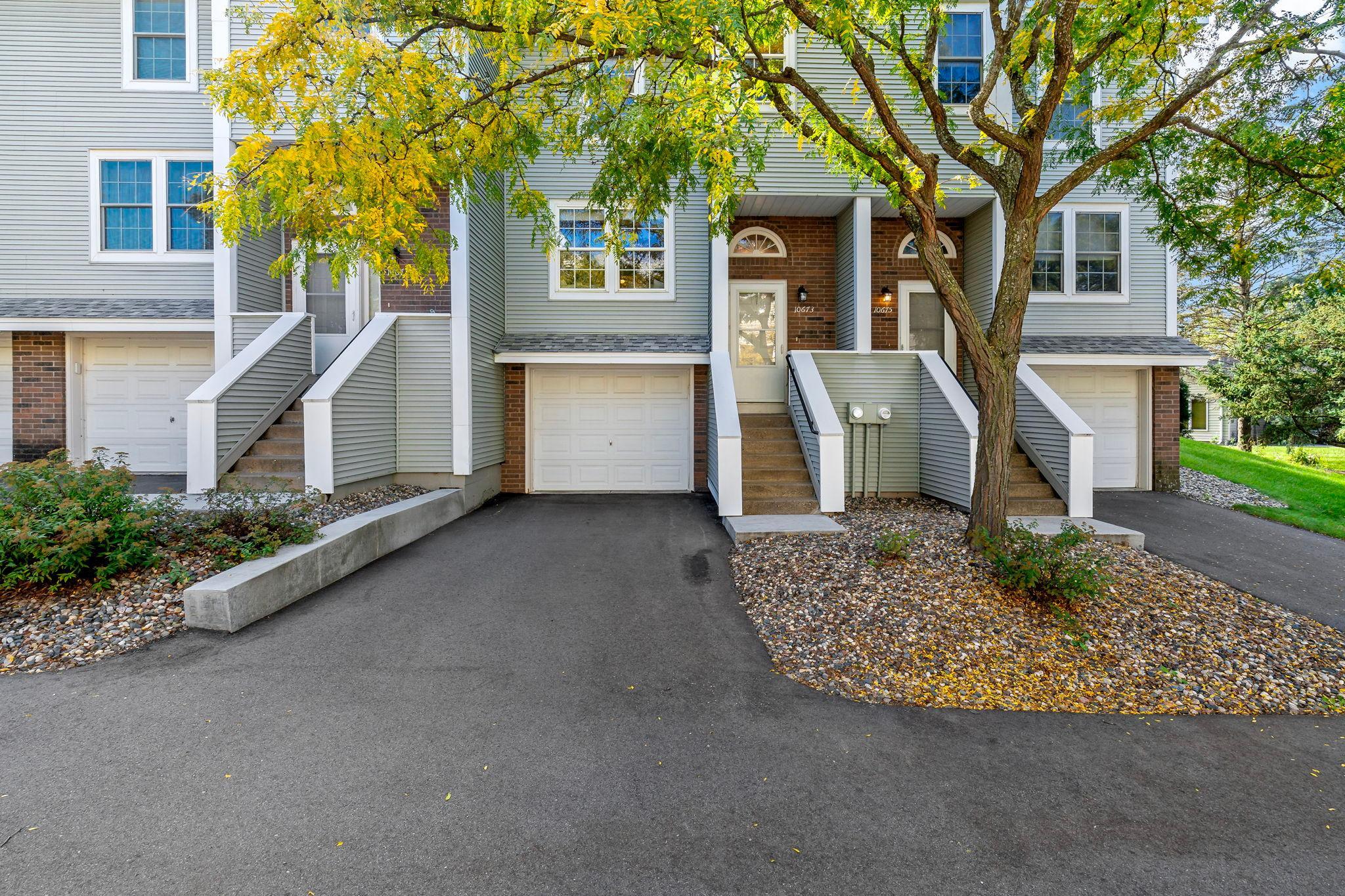 Welcome to this inviting 2-bedroom, 2-bathroom Eden Prairie townhome featuring an attached garage and a convenient location near walking trails and parks. Mature trees and established landscaping create a welcoming setting as you arrive home.