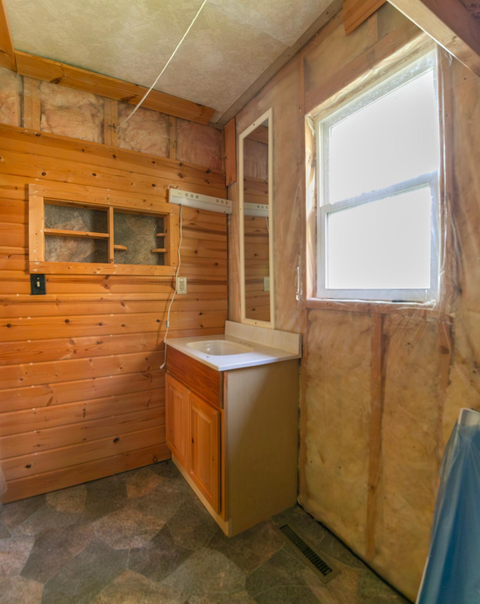 Bathroom, vanity installed, needs to have water and faucet connected.