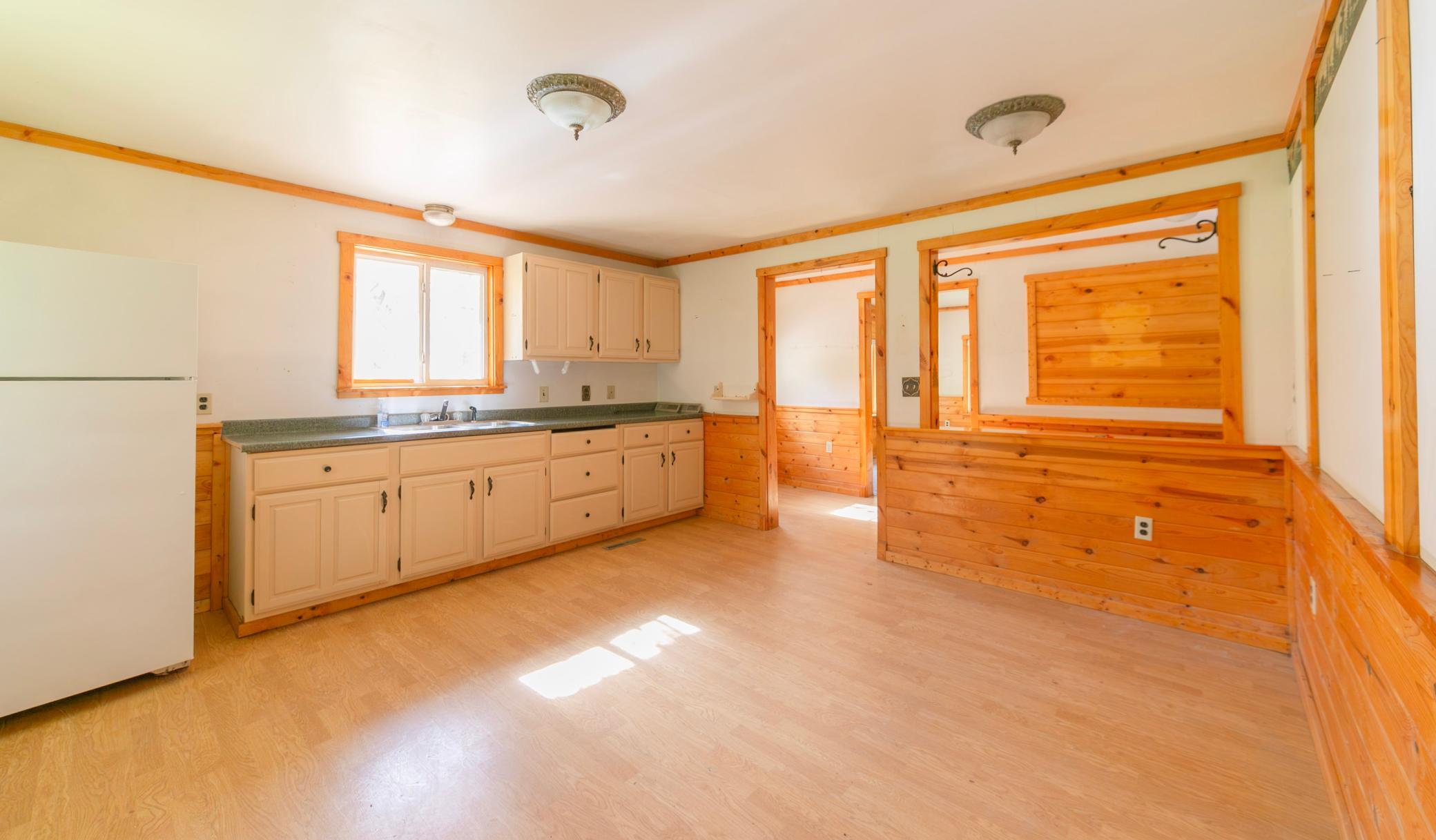 Kitchen and dining area looking to front door