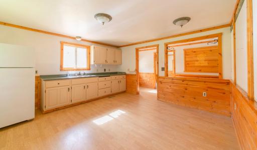 Kitchen and dining area looking to front door