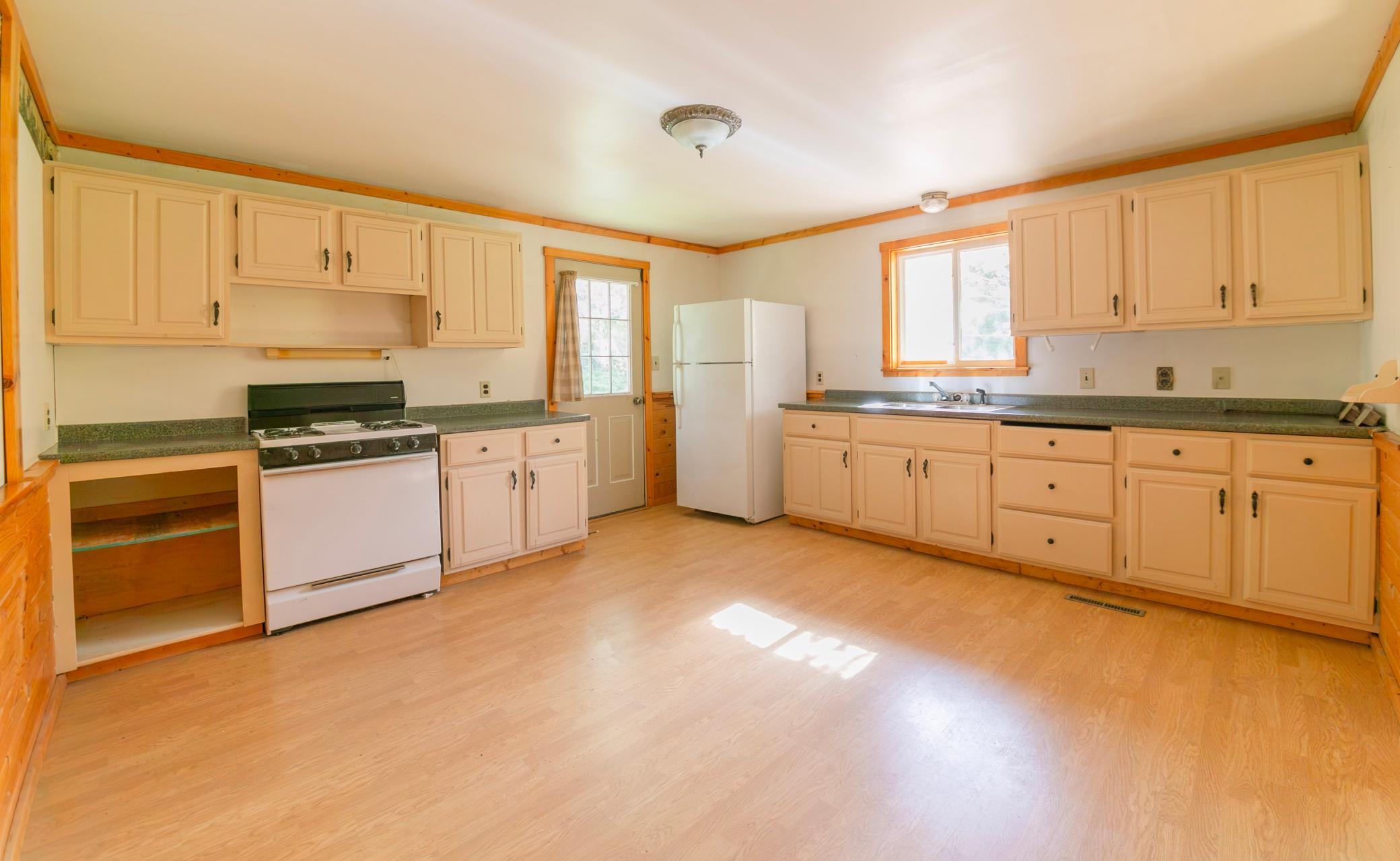 Nice large kitchen with plenty of natural light and a side door to outdoors.