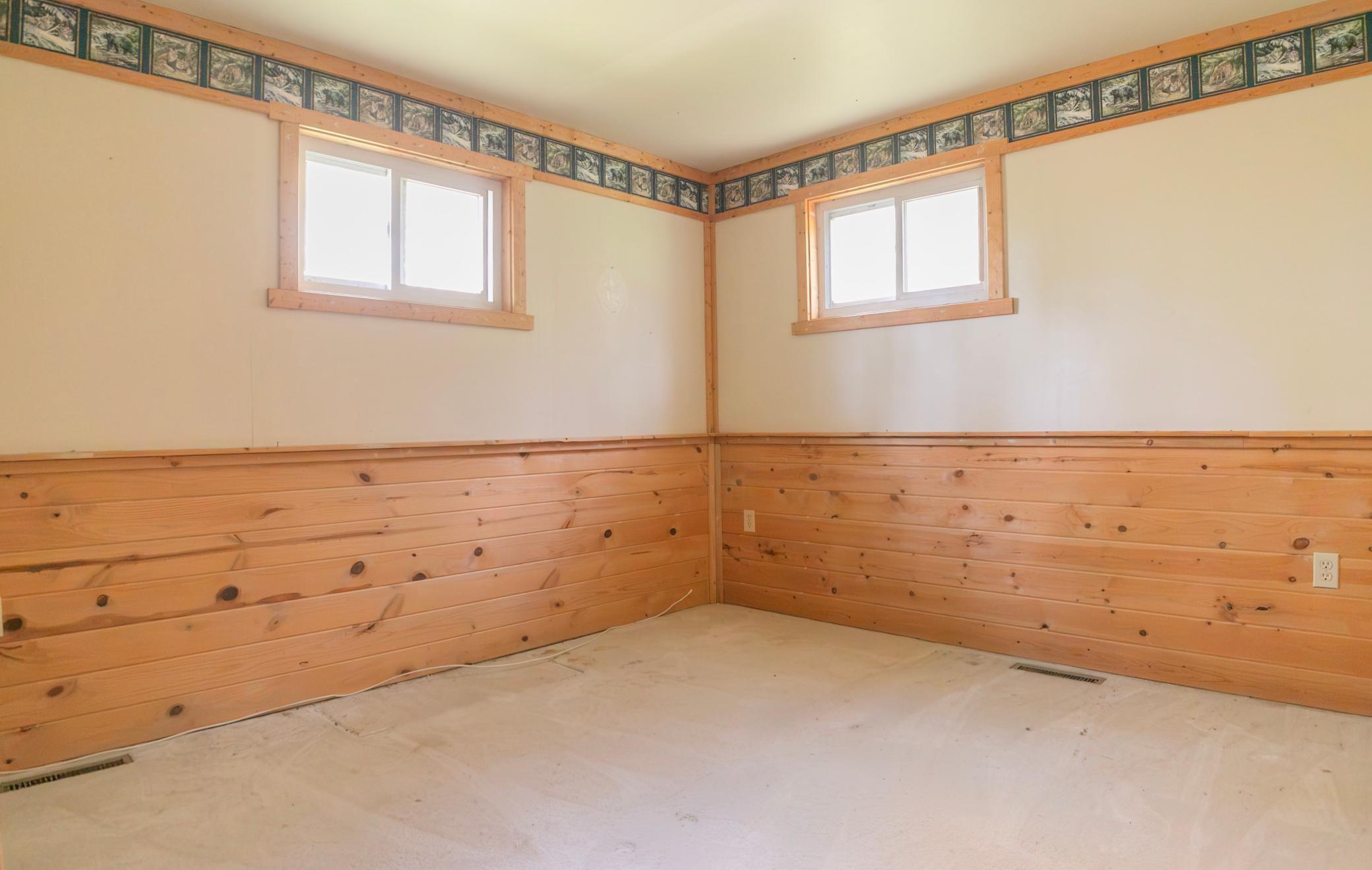 Bedroom 1 to the right of the bathroom