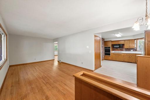 The surprisingly open floor plan feels spacious and connected, with the living and dining areas flowing naturally into the eat-in kitchen. The kitchen has new LVP tile flooring.