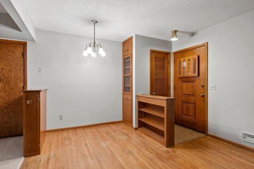 Lots of original features built-in bookshelf and buffet, solid wood louvered closet door, entry light and shutter on entry door.