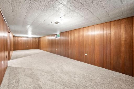 This large space could be used as a living room, office space, exercise or recreational room.