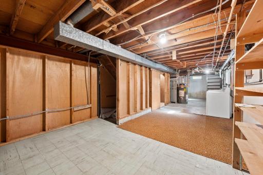 Large laundry and utility space. Plenty of room for storage or work bench.