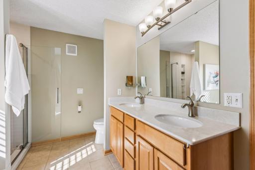 Updated primary bathroom with separate shower and bathtub. Double vanity.