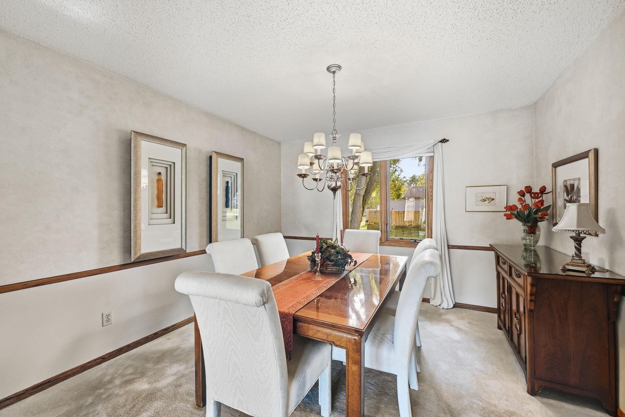 Full view of the dining featuring wainscoting