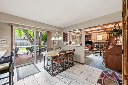 Informal dining walk out to huge deck overlooking the serene yard. The trees provide shade for the hot summer afternoons while great for your morning coffee or anytime just relaxing or entertaining