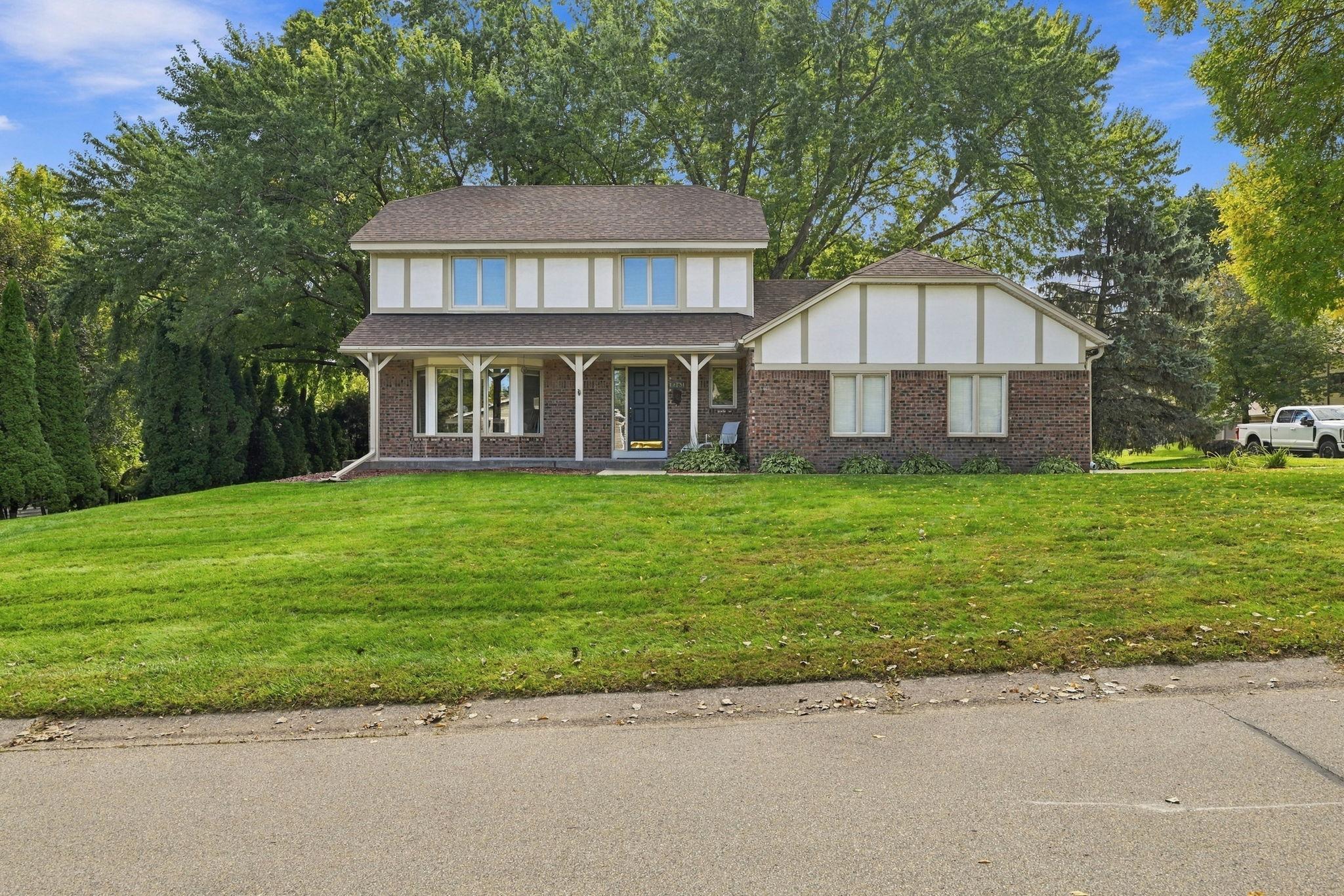 Inviting front elevation highlighting the large charming front porch