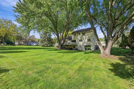 View of the lovely back yard showing the rear view of the home
