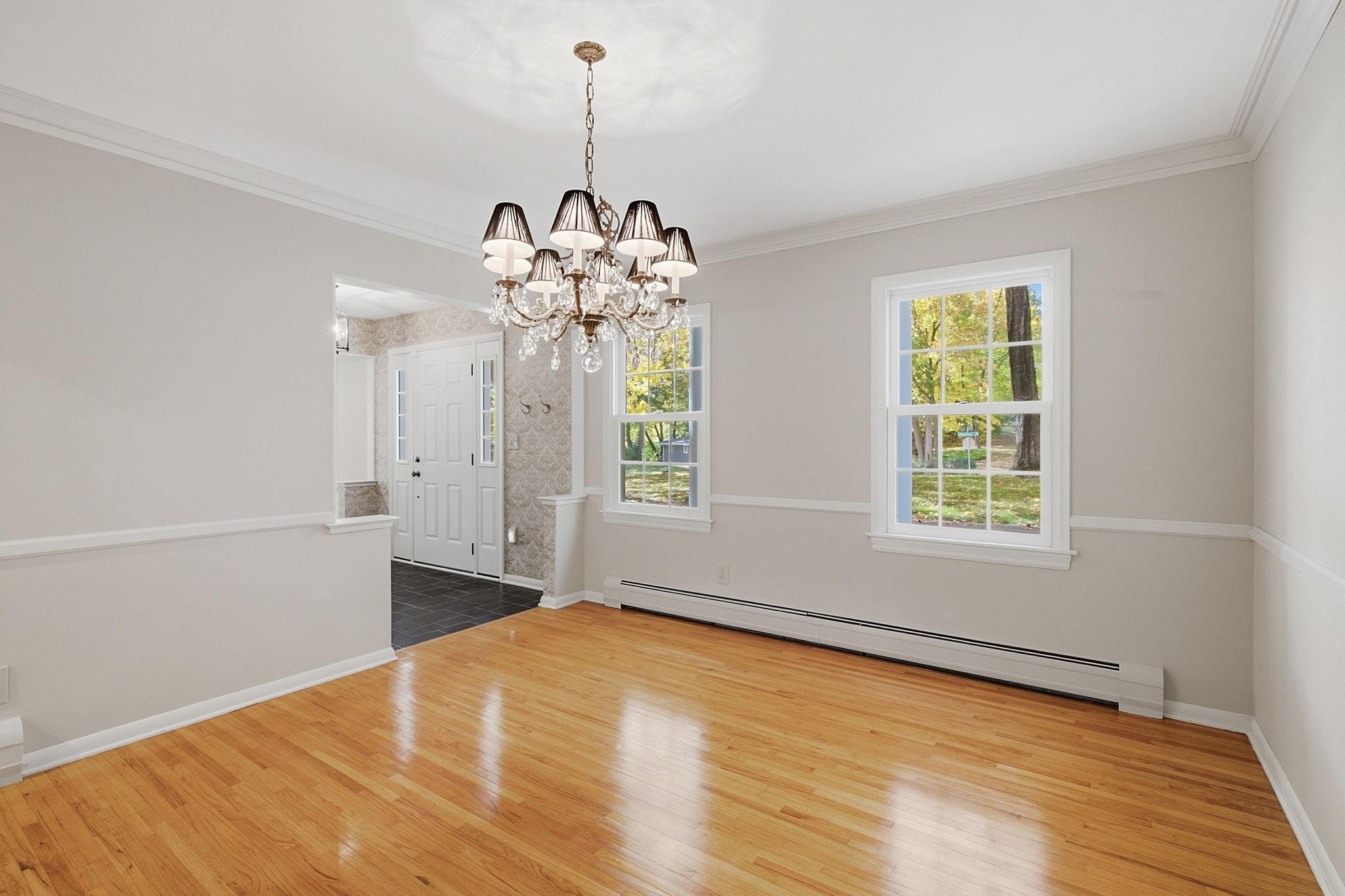 Formal dining room with views of the front yard
