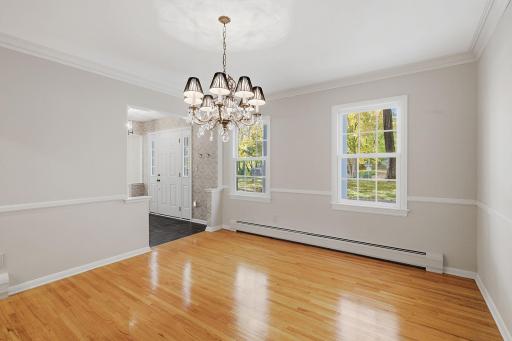 Formal dining room with views of the front yard