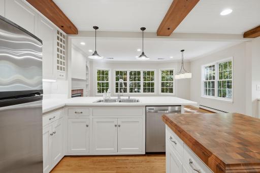 Freshly painted main living areas showcase the stunning exposed beams and charming design details