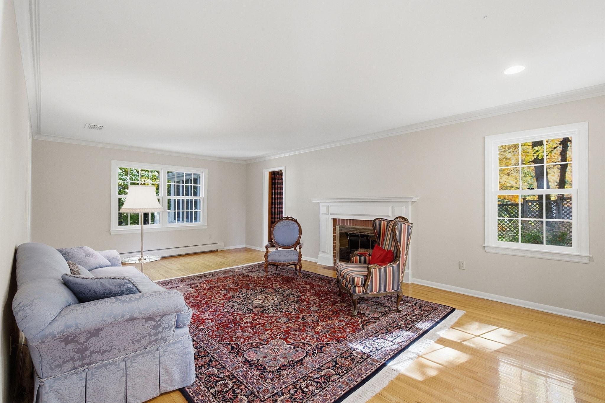 Freshly painted with gleaming wood floors carrying into this space