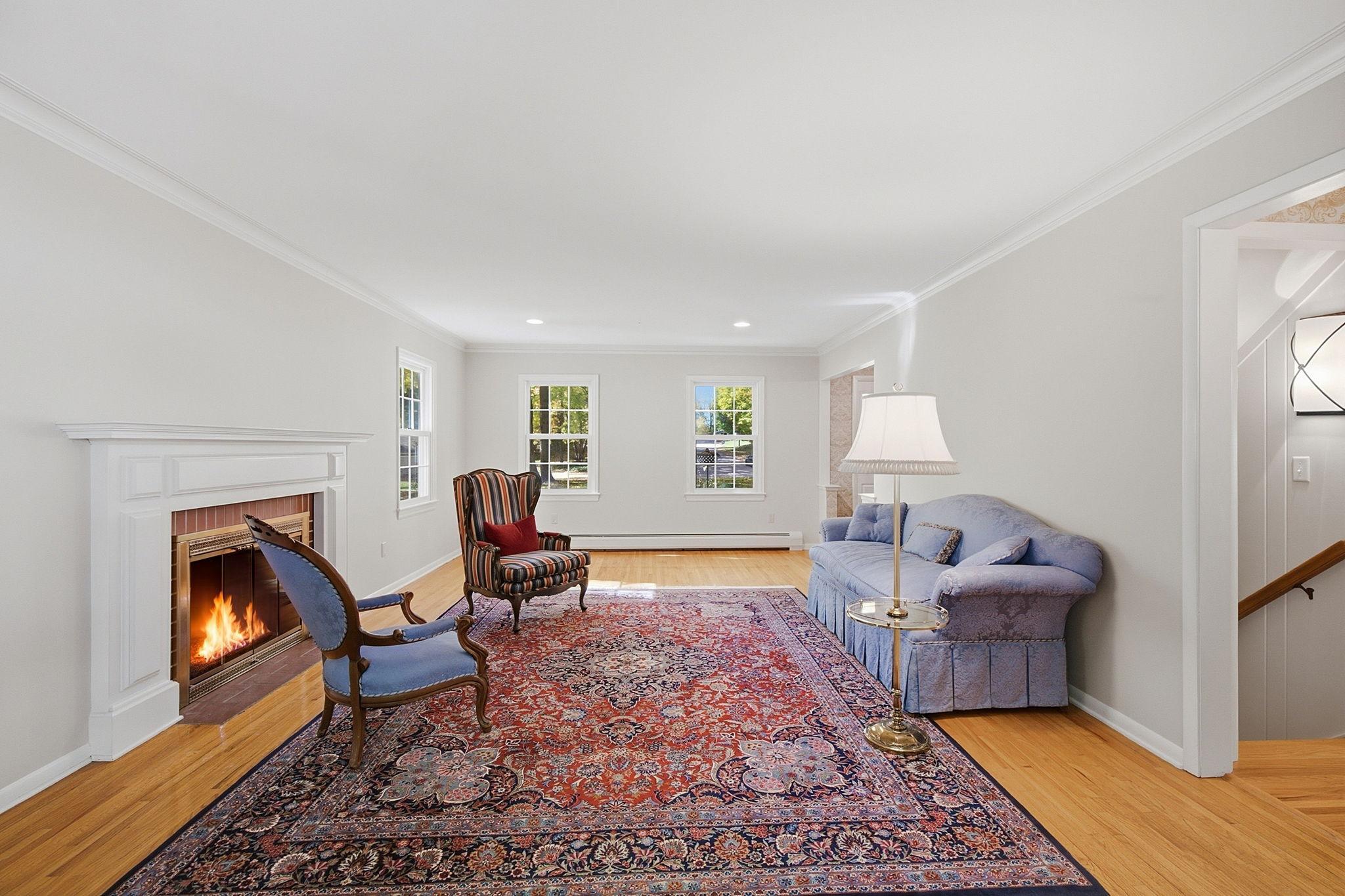 Formal living room with a wood burning fireplace