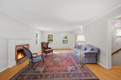 Formal living room with a wood burning fireplace