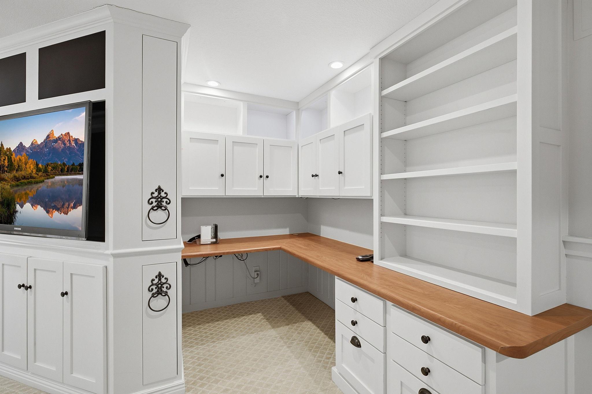 Additional office space tucked back with room for games and office supplies
