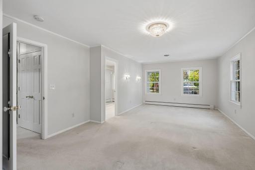 Spacious upper level primary bedroom with ensuite bath