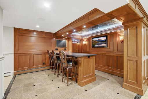Lower level Irish Pub Bar with bar seating and intricate ceiling details