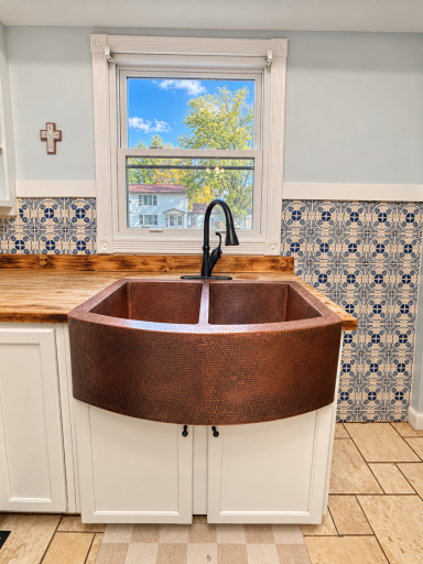 Oversized copper farmhouse-style kitchen sink