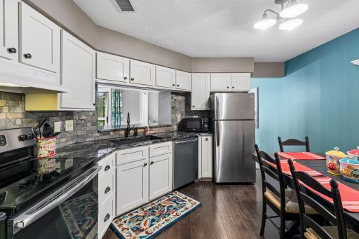 Another view of the kitchen and pass through window/breakfast bar