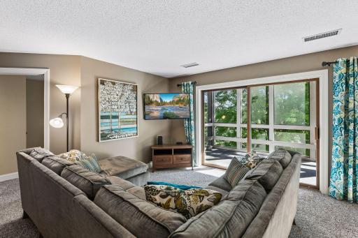 Spacious living room with direct access to the screen porch.