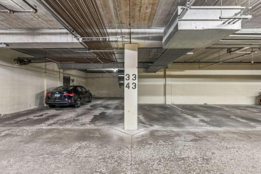 Units parking stall is the one to the right of the pillar