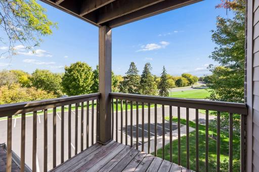 This private covered balcony is off the primary bedroom.