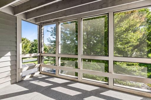 The screen porch may be a favorite space during the summer months