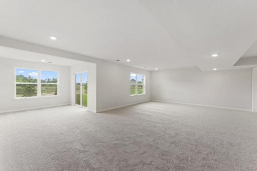 Finished lower level recreation area - Photo of a similar home.