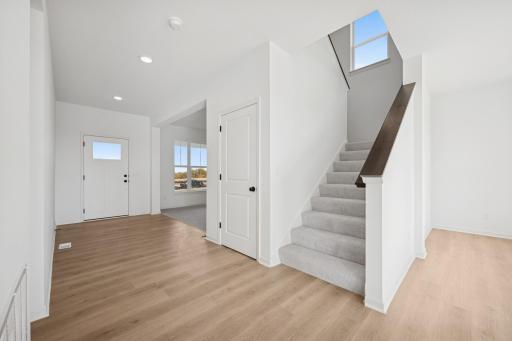 Home under construction, photo of similar home, selections vary.