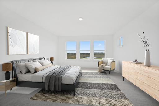 Bright and spacious with large windows and peaceful views, this primary suite offers a relaxing escape. Home under construction, photo of similar home, selections vary. (This is a virtually staged photo)